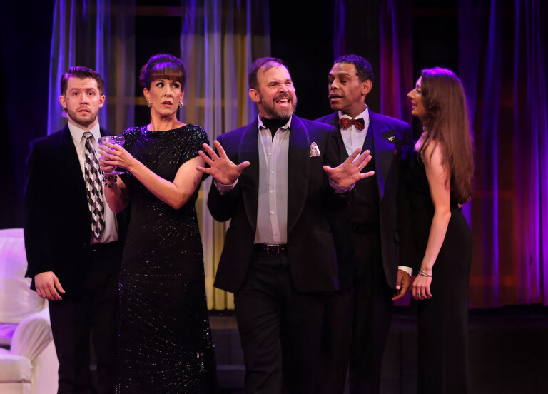 five people standing in cocktail attire